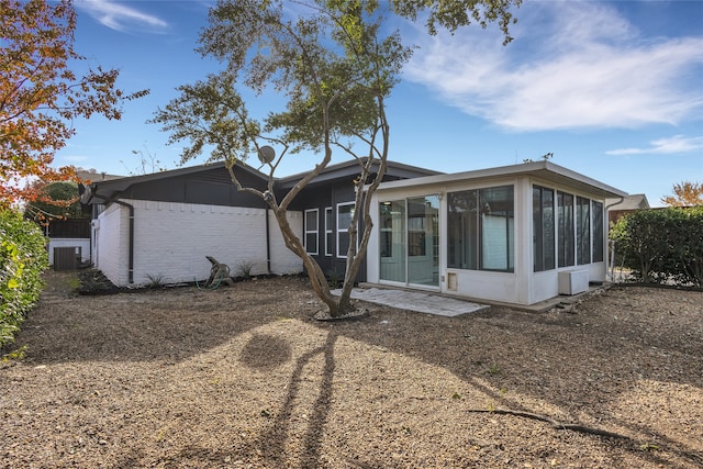 rear view of house with a sunroom