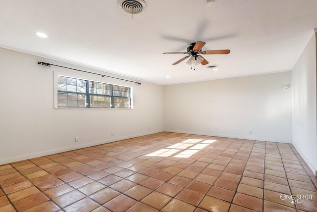 tiled spare room with ceiling fan and ornamental molding