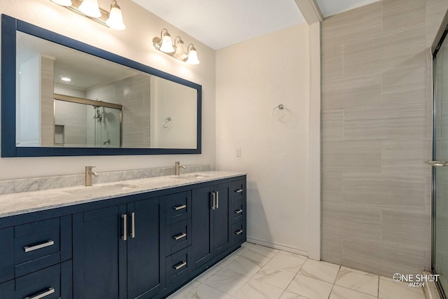 bathroom featuring vanity and a shower with shower door