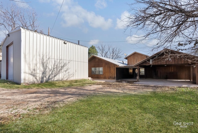 view of outbuilding featuring a yard and a garage