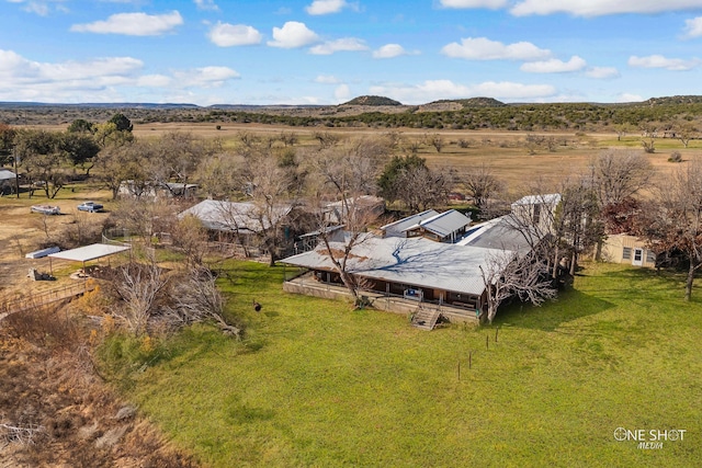 drone / aerial view featuring a mountain view and a rural view