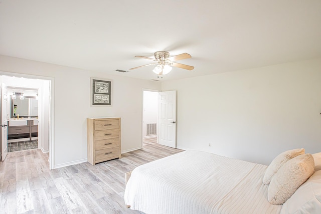 bedroom with ceiling fan, sink, and light hardwood / wood-style flooring