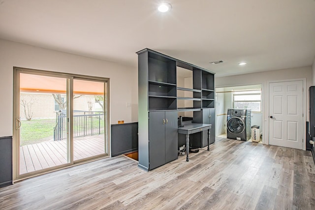 office space featuring light hardwood / wood-style flooring and washer / dryer