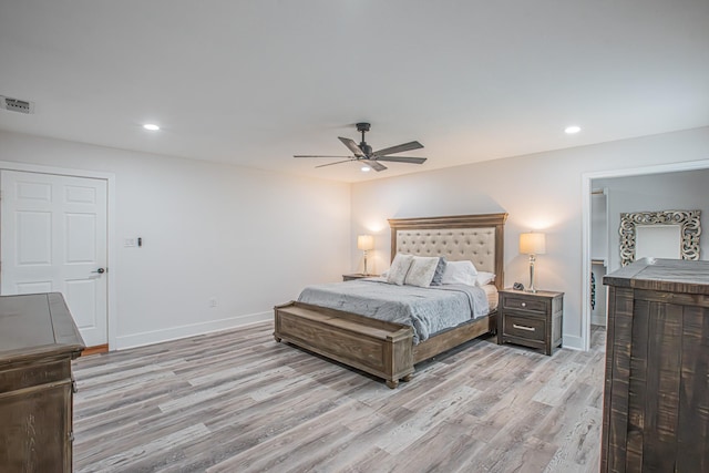 bedroom with ceiling fan and light hardwood / wood-style flooring