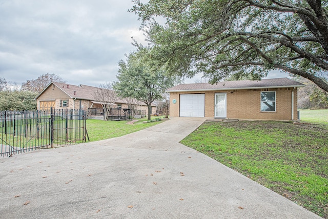 view of front of home with a garage and a front lawn