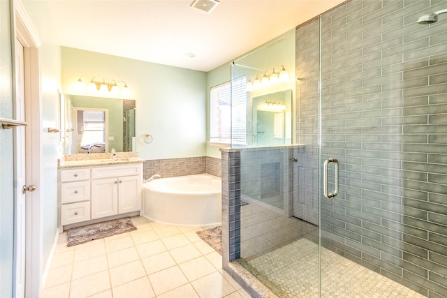 bathroom with vanity, separate shower and tub, and tile patterned floors