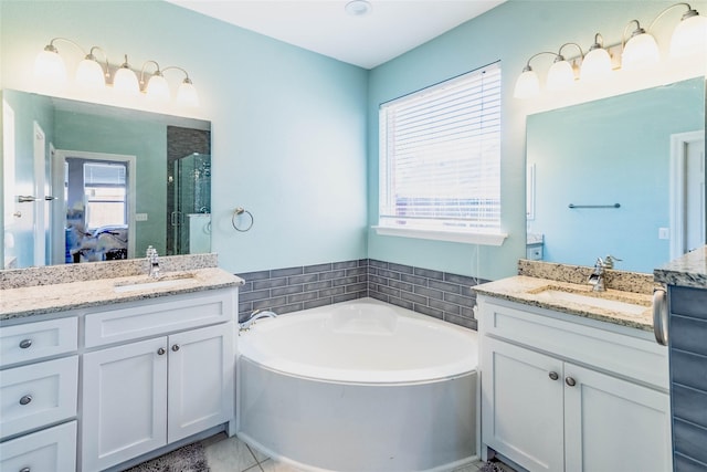 bathroom featuring separate shower and tub, tile patterned floors, and vanity