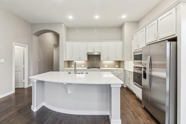 kitchen featuring white cabinetry, an island with sink, and appliances with stainless steel finishes