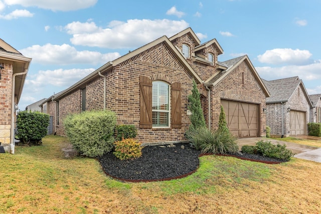 view of front of house with a front yard and a garage