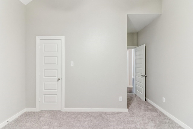 unfurnished bedroom featuring light colored carpet