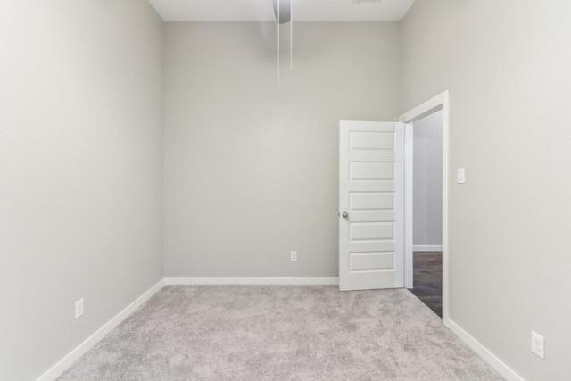 unfurnished room with light colored carpet