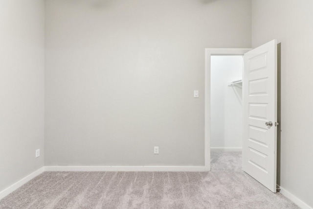 empty room with light colored carpet