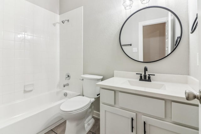 full bathroom with tile patterned flooring, vanity, shower / bathtub combination, and toilet