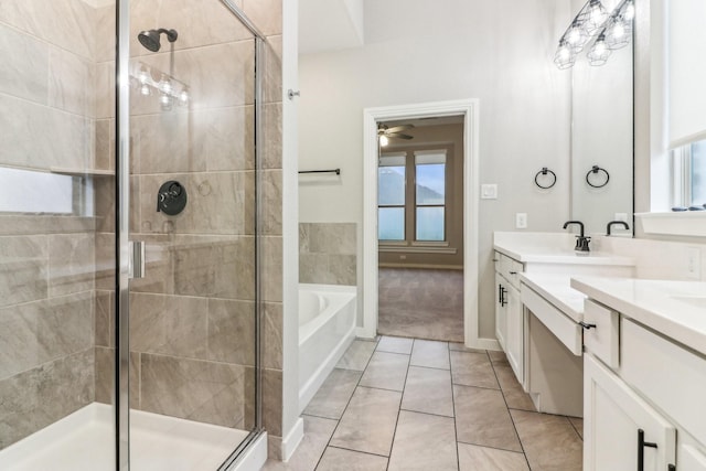 bathroom with tile patterned flooring, ceiling fan, vanity, and independent shower and bath