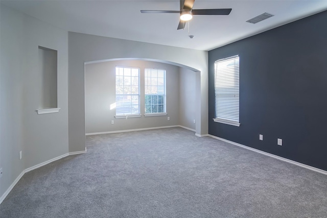 spare room with carpet flooring and ceiling fan