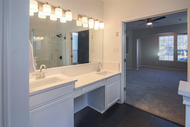 bathroom featuring ceiling fan, tile patterned flooring, vanity, and an enclosed shower