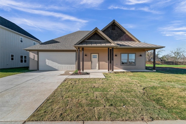 view of front of property with a garage and a front yard