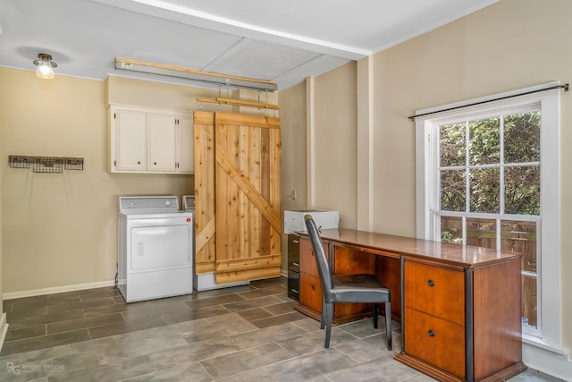 laundry area featuring washer / clothes dryer, cabinets, and a barn door