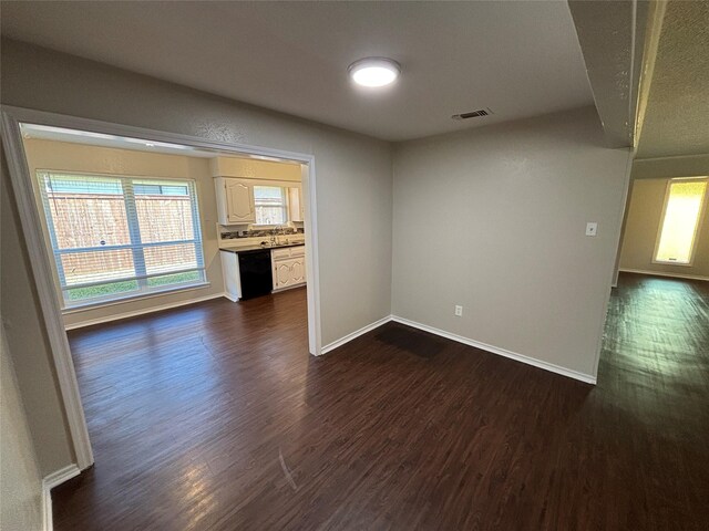 empty room featuring dark wood-type flooring