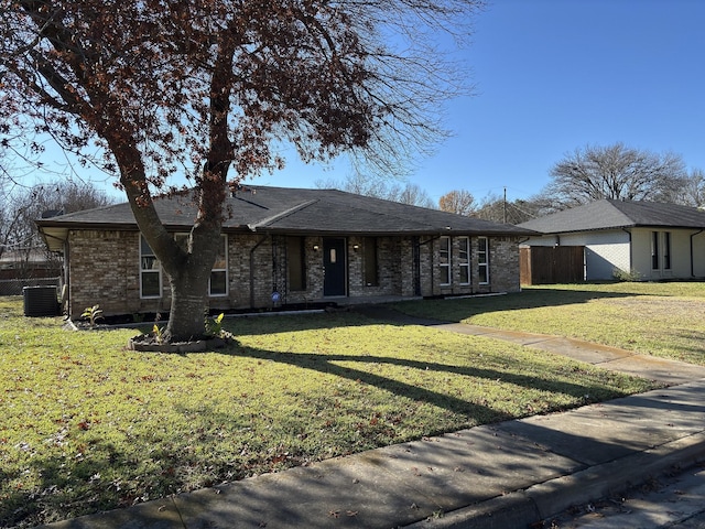 single story home featuring central AC unit and a front yard