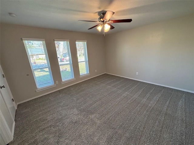 carpeted empty room with ceiling fan