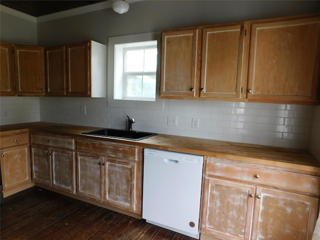 kitchen with dishwasher, wooden counters, backsplash, and sink