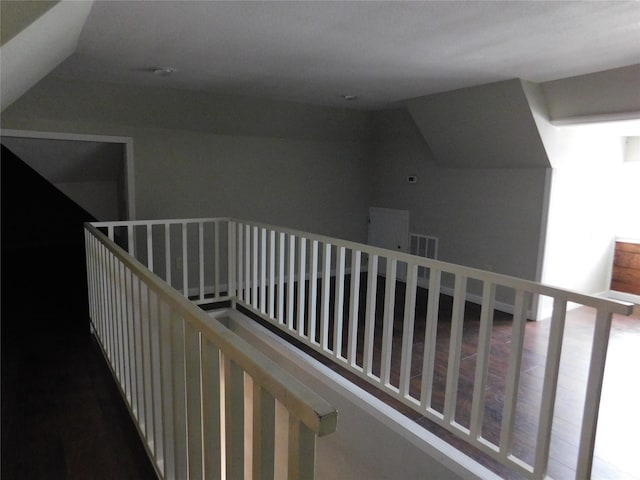 hallway featuring vaulted ceiling