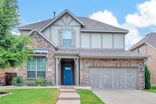 tudor-style house with a garage and a front yard