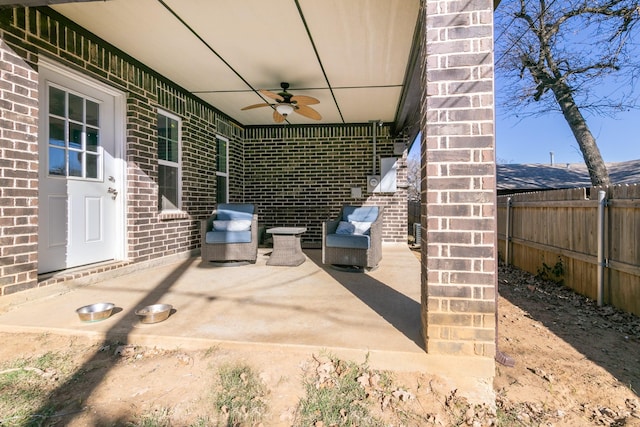 view of patio featuring ceiling fan