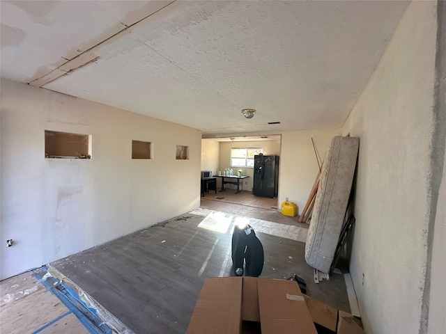 hallway featuring a textured ceiling