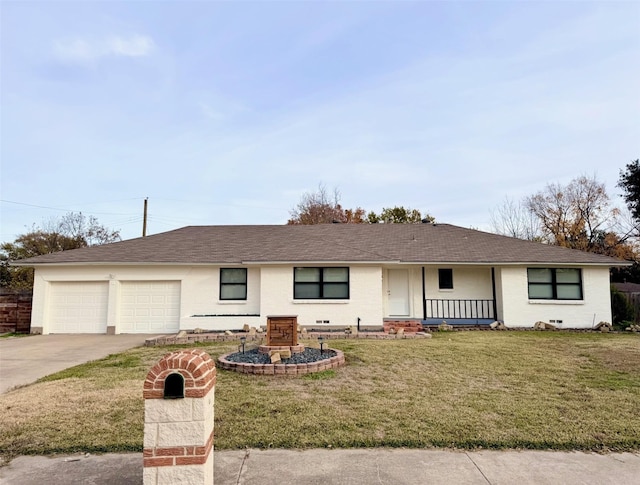 ranch-style house featuring a porch, a garage, and a front lawn