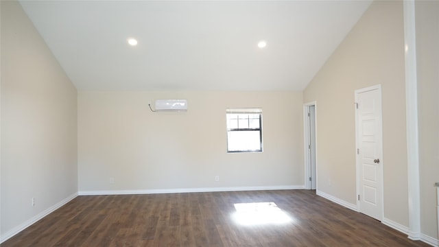 empty room featuring a wall mounted air conditioner, high vaulted ceiling, and dark hardwood / wood-style floors