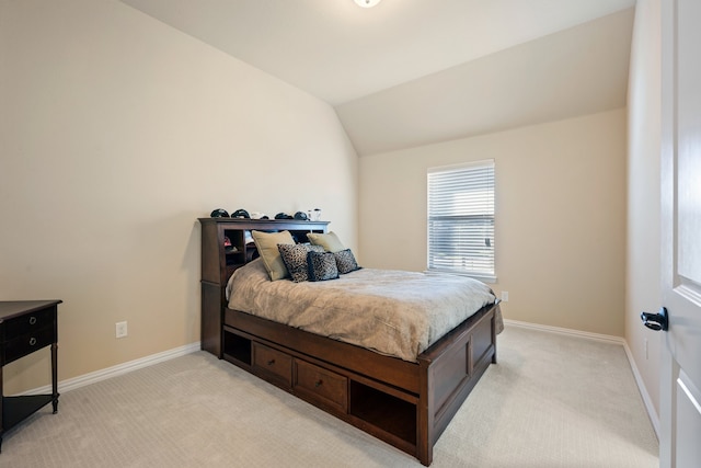 carpeted bedroom featuring vaulted ceiling