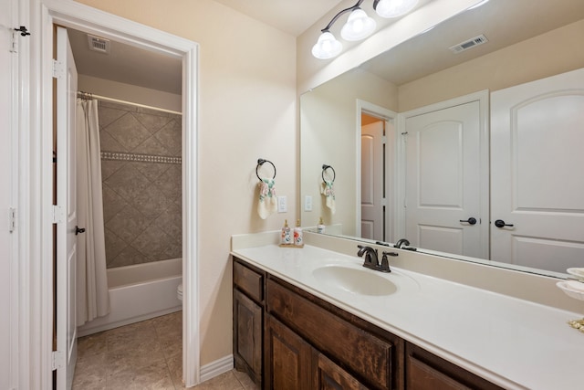 full bathroom featuring vanity, shower / bath combination with curtain, and toilet