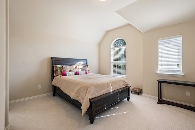 carpeted bedroom featuring vaulted ceiling