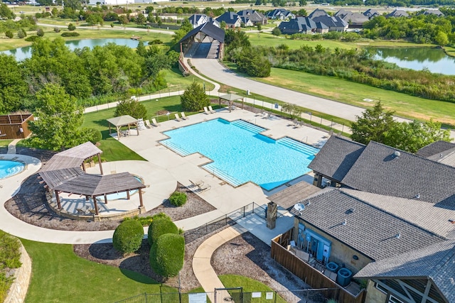 view of swimming pool with a gazebo, a water view, and a patio area