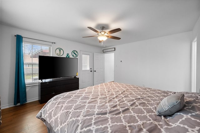 bedroom with ceiling fan and wood-type flooring