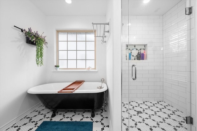 bathroom featuring shower with separate bathtub and tile patterned flooring