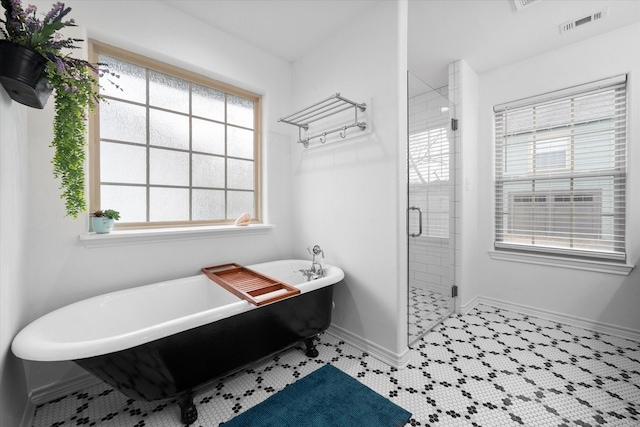 bathroom with shower with separate bathtub