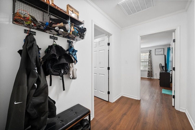 mudroom with crown molding and dark wood-type flooring