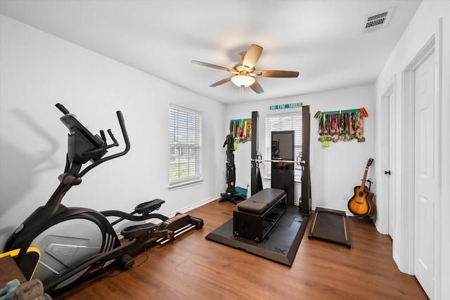 exercise area with hardwood / wood-style flooring and ceiling fan