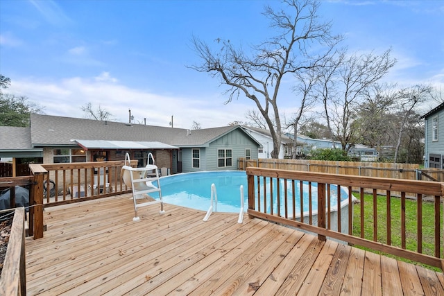 view of pool with a wooden deck