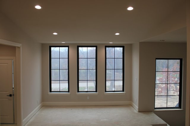 spare room featuring vaulted ceiling