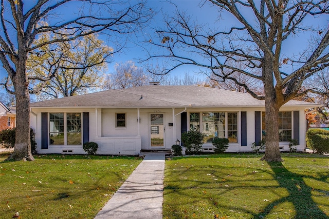 ranch-style house with a front lawn