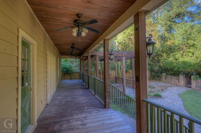 wooden terrace with a pergola and ceiling fan