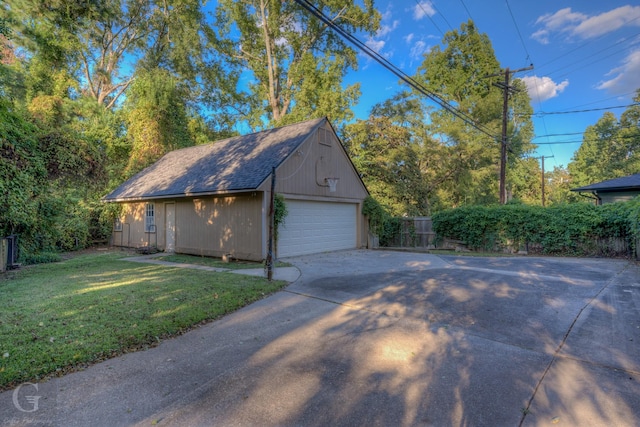 garage featuring a lawn