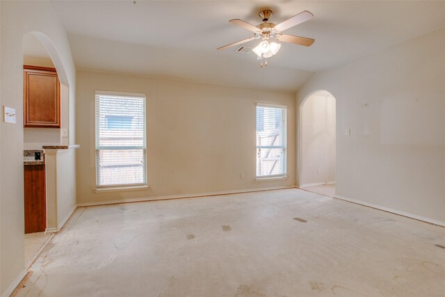 unfurnished room with lofted ceiling and ceiling fan