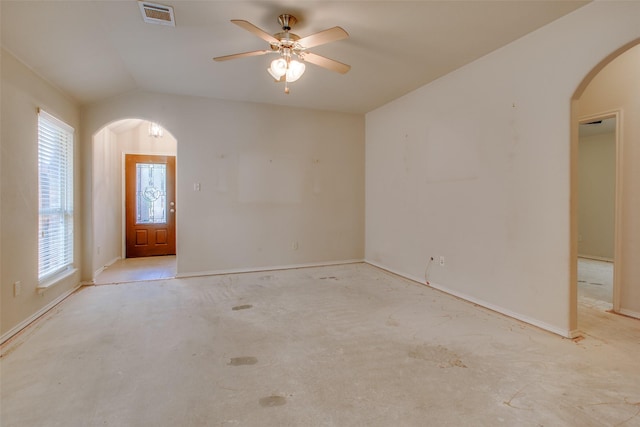 spare room with ceiling fan and vaulted ceiling