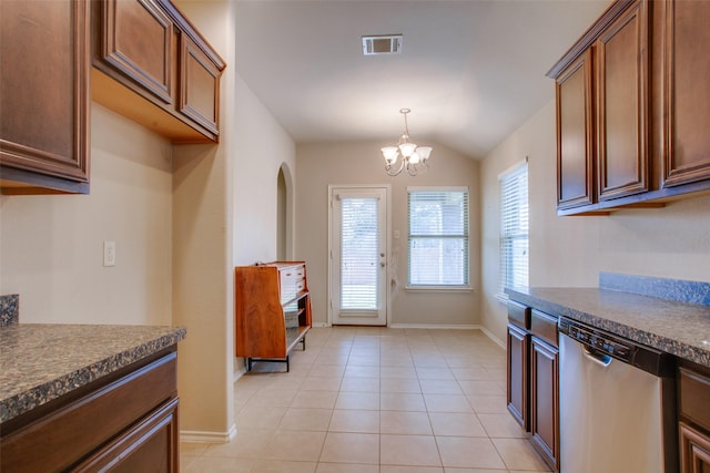 kitchen featuring light tile patterned flooring, decorative light fixtures, vaulted ceiling, dishwasher, and a notable chandelier