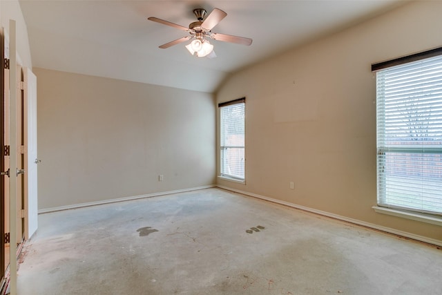 unfurnished room featuring lofted ceiling and ceiling fan